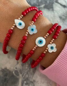 Red Coral Mother of Pearl Bracelet with vibrant red beads and lustrous mother of pearl, elegant and timeless jewelry. Ships worldwide (UAE, USA, KSA)