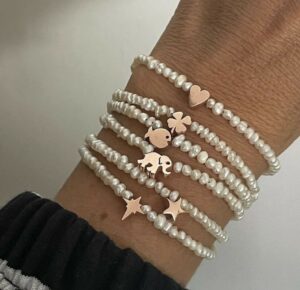 Custom Pearl Bracelet with 925 sterling silver charm, heart, star, clover, elephant, fish, spark, or letter, paired with elegant pearls. Ships worldwide (UAE, USA, KSA)
