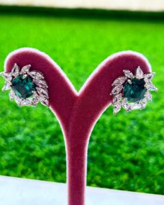 Emerald Stud Signature Earrings in 925 sterling silver with royal green emerald stones. Shipped to UAE, Saudi Arabia, USA & UK.