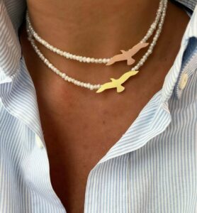 Flying Birds Pearl Necklace with 925 sterling silver charm, featuring lustrous pearl and graceful bird design, ships worldwide (UAE, USA, KSA)